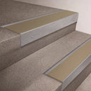 Mill Aluminium finish 66x55mm raked back aluminium stair nosing with a Light Bronze Aluminium insert, fitted to interior steps