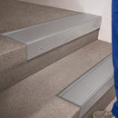 Mill Aluminium finish 66x55mm raked back aluminium stair nosing with a Mill Aluminium insert, fitted to interior steps