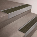 Mill Aluminium finish 66x55mm raked back aluminium stair nosing with a Olive Castellated insert, fitted to interior steps