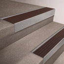 Mill Aluminium finish 66x55mm raked back aluminium stair nosing with a Peat Castellated insert, fitted to interior steps