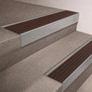 Mill Aluminium finish 66x55mm raked back aluminium stair nosing with a Peat Castellated insert, fitted to interior steps