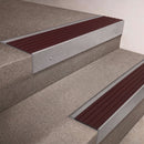 Mill Aluminium finish 66x55mm raked back aluminium stair nosing with a Regency Castellated insert, fitted to interior steps