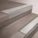 Mill Aluminium finish 66x55mm raked back aluminium stair nosing with a Satin Aluminium insert, fitted to interior steps