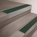 Mill Aluminium finish 66x55mm raked back aluminium stair nosing with a Spruce Castellated insert, fitted to interior steps