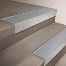 Satin Aluminium finish 66x55mm raked back aluminium stair nosing with a Mill Aluminium insert, fitted to interior steps