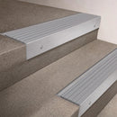 Satin Aluminium finish 66x55mm raked back aluminium stair nosing with a Polar Grey Castellated insert, fitted to interior steps