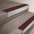 Satin Aluminium finish 66x55mm raked back aluminium stair nosing with a Regency Castellated insert, fitted to interior steps