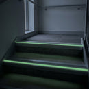 67x55mm stair nosing glowing green along each step edge in a dark stairwell during a power cut, no wiring or power needed