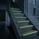 68x33mm stair nosing glowing green along each step edge in a dark stairwell during a power cut, no wiring or power needed