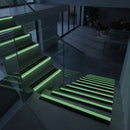 87x40mm bullnose stair nosing glowing green along each step edge in a dark stairwell during a power cut, no wiring or power needed