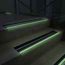 91x32mm double insert stair nosing glowing green along each step edge in a dark stairwell during a power cut, no wiring needed