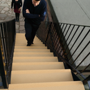 Anti-slip stair tread cover, stone finish, installed on heritage outdoor stairs