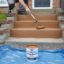 Brown anti-slip step paint being applied to brick-edged concrete steps with a roller