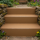 Brown FootGrip anti-slip step paint applied to concrete steps, traditional stone cottage steps in a countryside garden