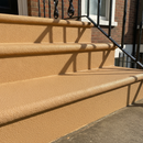 Sandstone FootGrip anti-slip step paint applied to concrete steps, period townhouse steps with a black iron railing