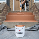 Terracotta anti-slip step paint being applied to concrete steps outside a house
