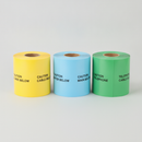 Three rolls of underground warning tape in yellow, blue and green on a plain studio background, each printed with repeating black caution text