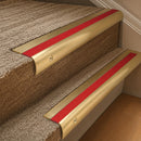 Satin Brass finish with Poppy Castellated insert - 63.5mm solid brass bullnose stair nosing fitted to a carpeted step
