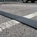 Thermoplastic road line marking tape – black strip masking an old line on asphalt