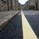 Thermoplastic road line marking tape – primrose heritage yellow line applied to asphalt