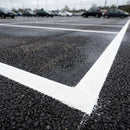 Thermoplastic road line marking tape – white parking bay lines applied to asphalt car park