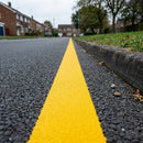 Thermoplastic road line marking tape – yellow edge line applied to asphalt road
