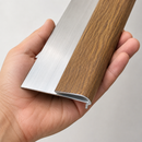 Push-in laminate stair nosing trim profiles in silver and oak finishes