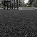 Anthracite grey artificial playground safety turf in an urban play area with a steel climbing structure and concrete planter
