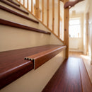 uPVC wood effect stair nosing in Mahogany fitted over a stair tread edge on a UK home staircase