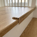 uPVC wood effect stair nosing in Natural Oak fitted over a stair tread edge on a UK home staircase