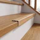 uPVC wood effect stair nosing in Noble Oak fitted over a stair tread edge on a UK home staircase