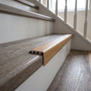 uPVC wood effect stair nosing in Rustic Oak fitted over a stair tread edge on a UK home staircase