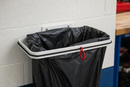 White steel wall mounted sack holder without a lid holding a refuse sack in a workshop