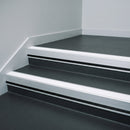 White Castellated insert in a cut to size 66x55mm aluminium stair nosing with 13mm black riser highlight, fitted to interior steps