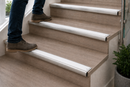 White anti-slip insert on a semi-rounded bullnose stair nosing