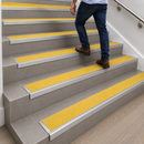 High visibility yellow insert on DDA compliant aluminium stair nosing