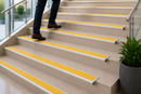 Yellow anti-slip insert on a semi-rounded bullnose stair nosing